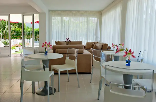 Lounge and café tables by the doors to the garden