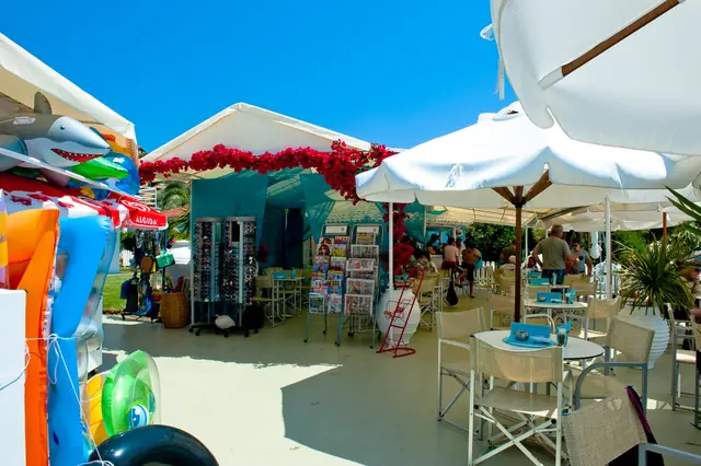 The hotel shop beside the bar, with inflatables and postcards